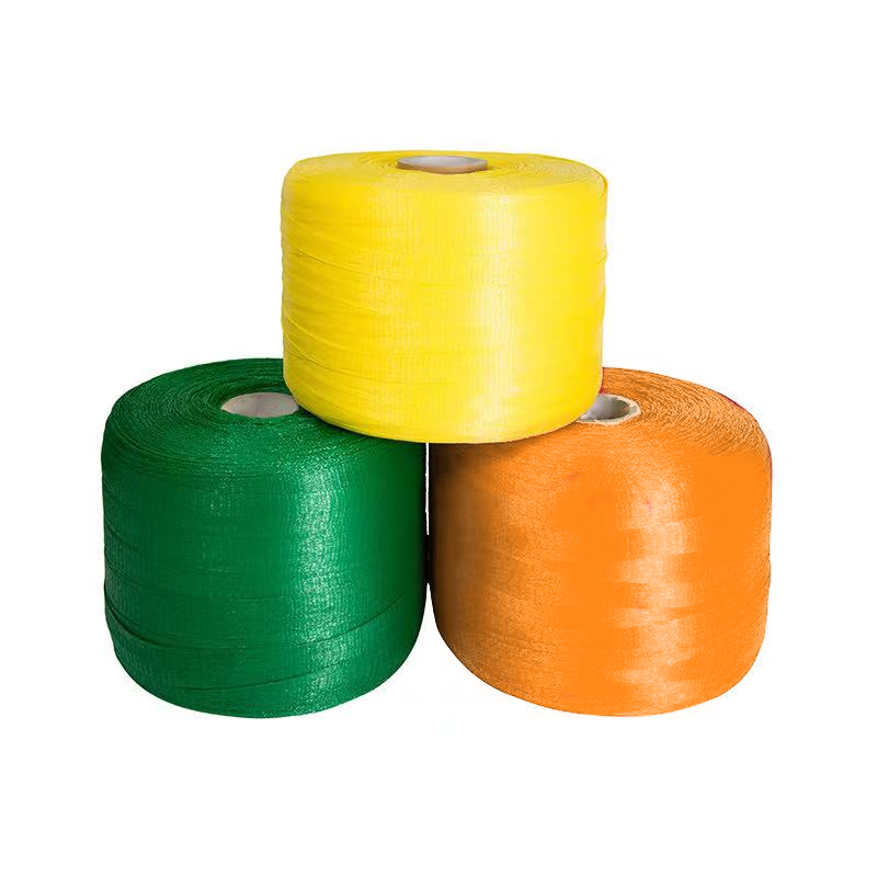 Rollos de malla tubular tejida de color amarillo, verde y naranja para envasar limones, naranjas, cebollas y aguacates en máquinas de soldadura térmica.